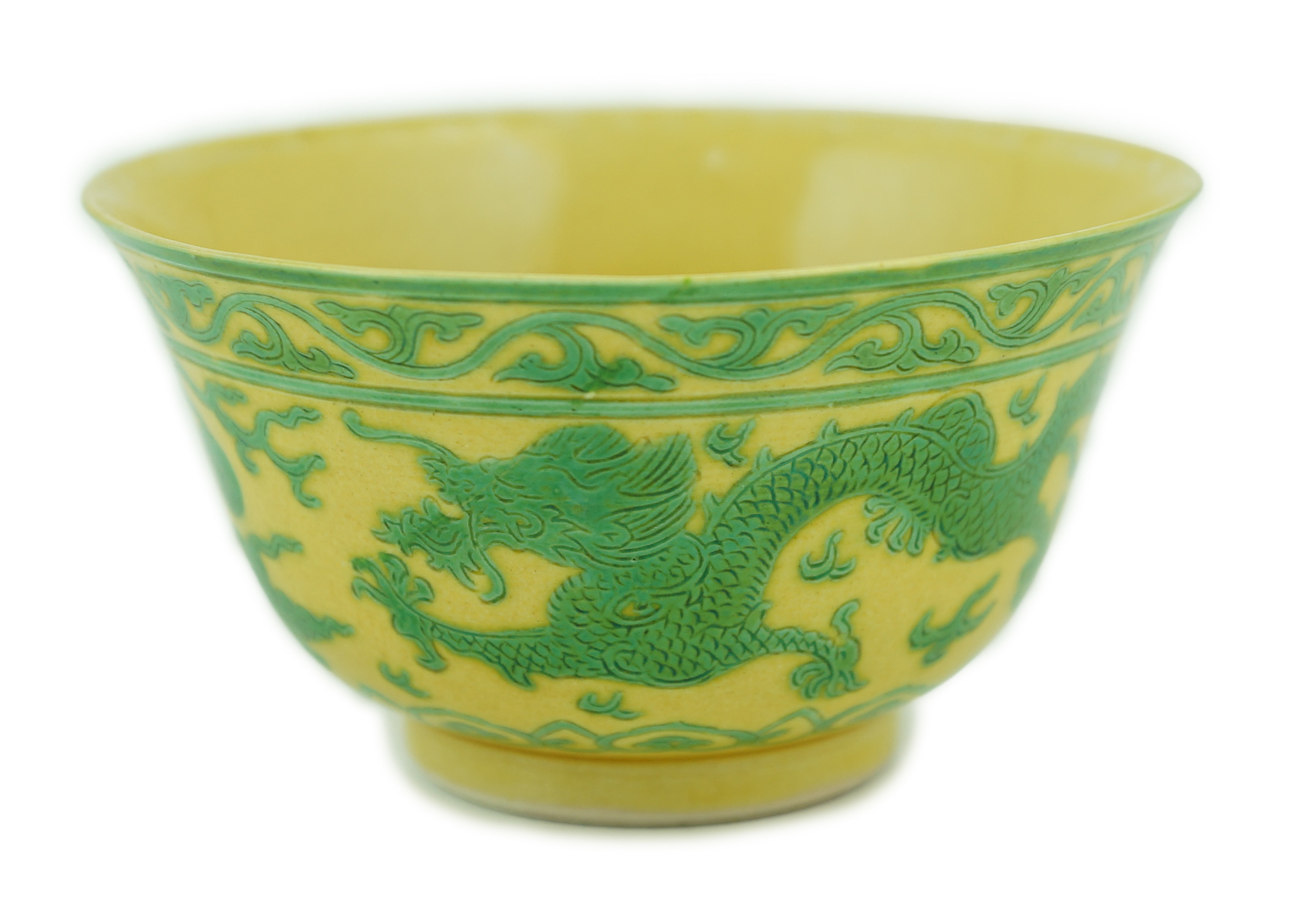 A Chinese green and yellow glazed 'dragon' bowl, Daoguang mark and of the period (1821-50), section of rim broken and restored, hairline cracks